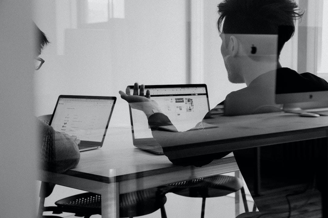 Two people discussing how does relationship mapping software work.